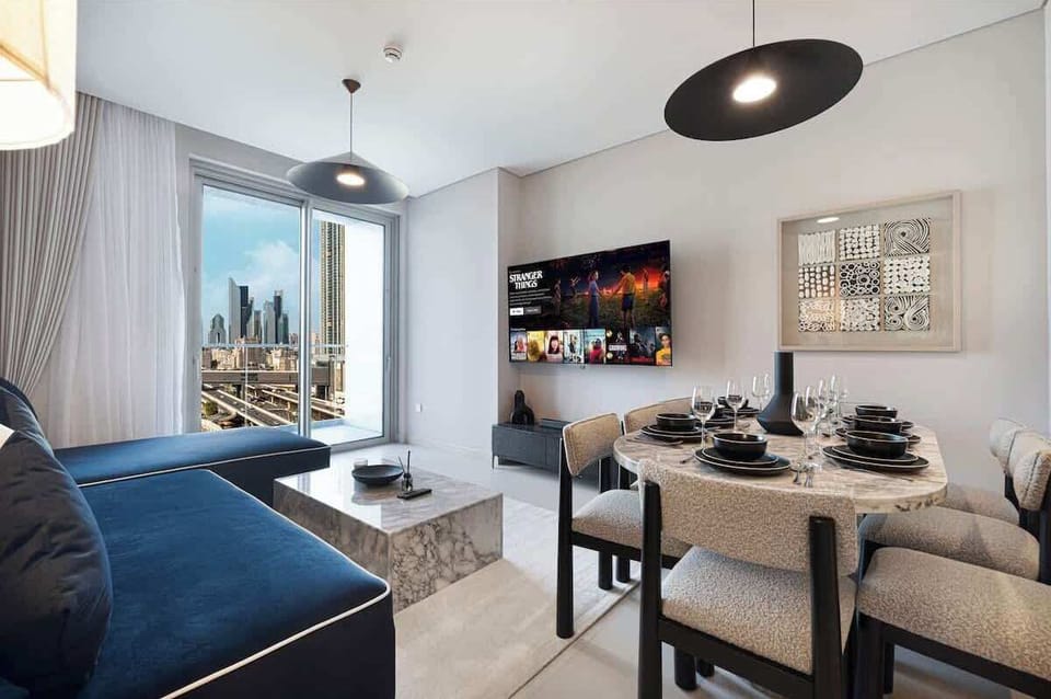 Featuring a seamless flow from living to dining, this area invites gatherings around a stylish table, ideal for family meals or entertaining guests