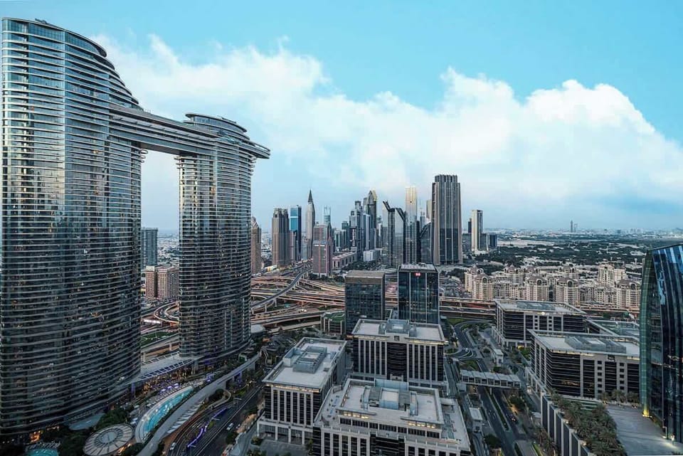Daytime city landscape featuring iconic buildings and lively streets
