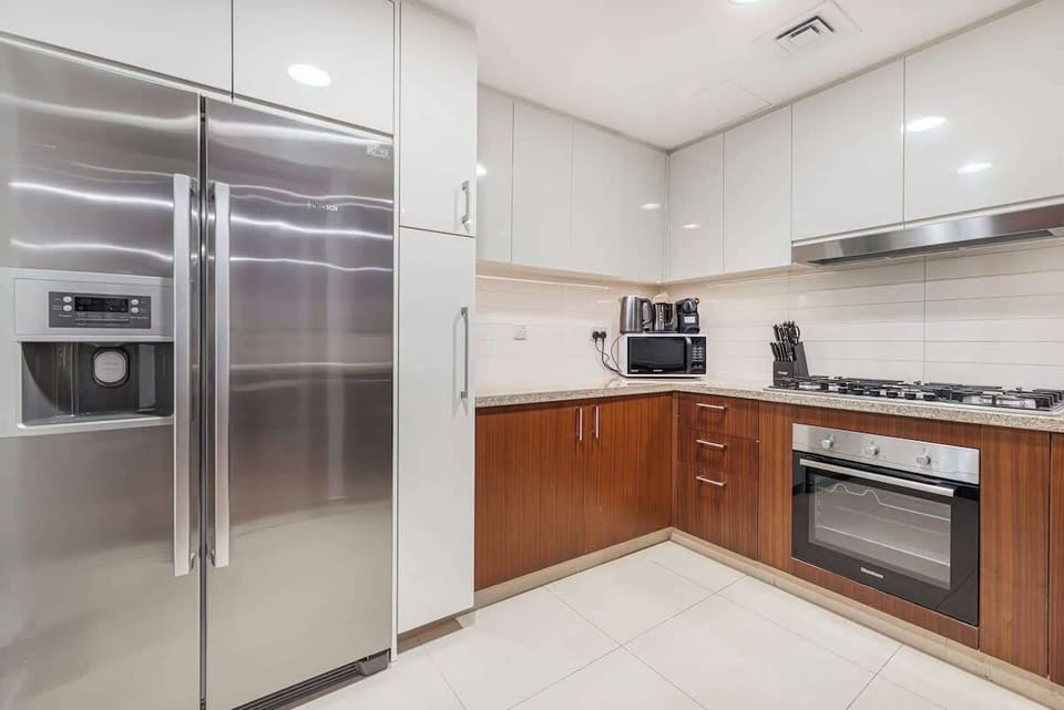 Thoughtfully equipped with basic cookware, this kitchen makes meal prep a breeze