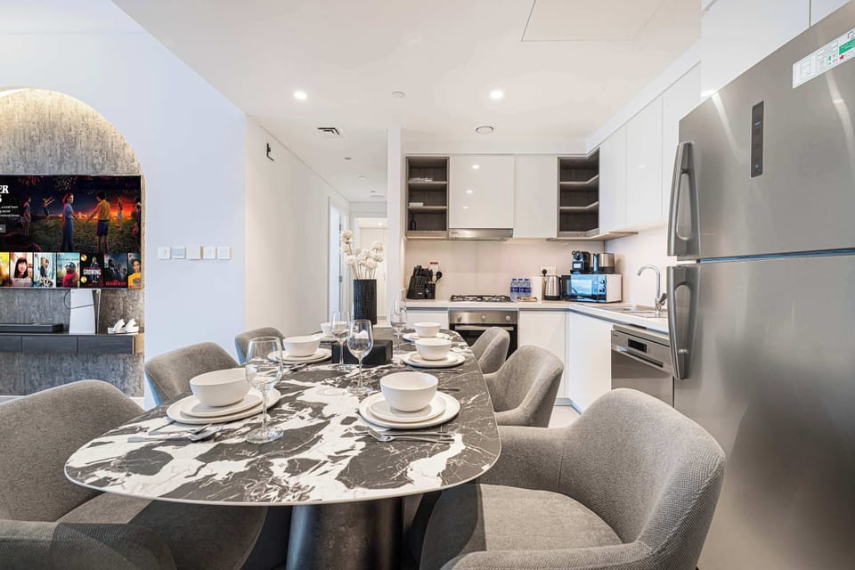 Modern, airy space with kitchen and inviting dining area