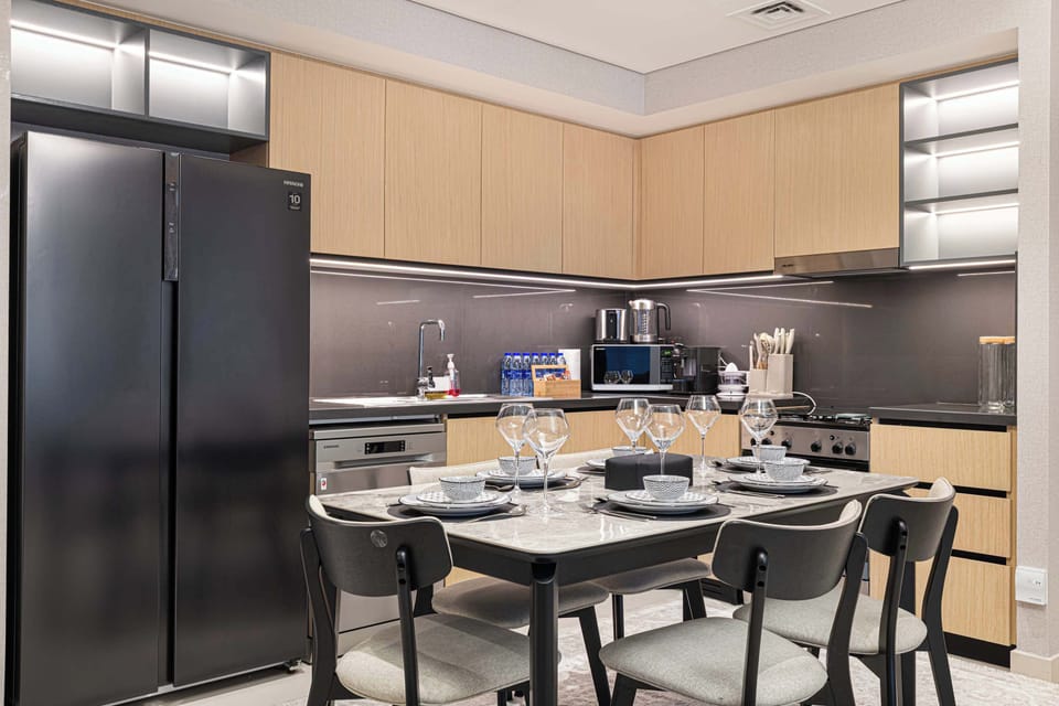 Sleek open space with kitchen and warm dining nook