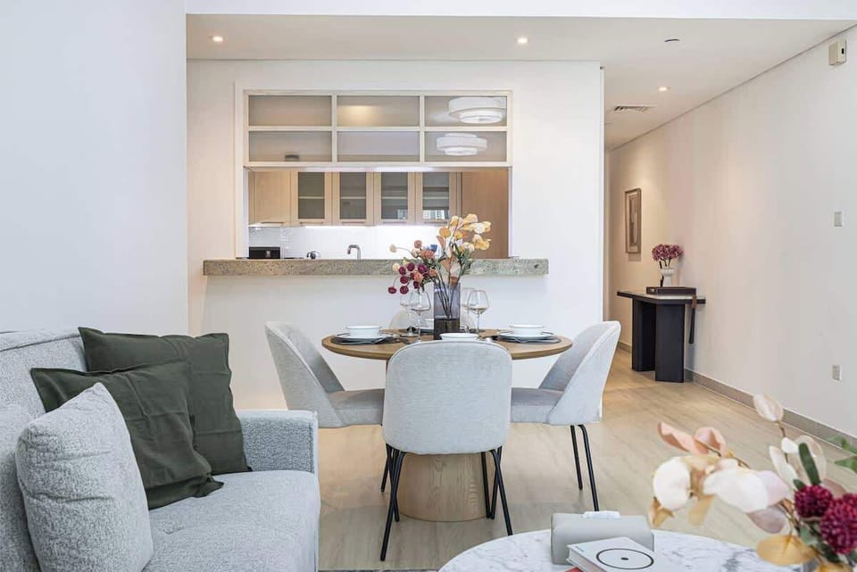 Featuring a seamless flow from living to dining, this area invites gatherings around a stylish table, ideal for family meals or entertaining guests