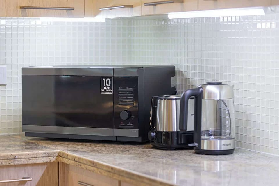 A stylish, open kitchen that’s as practical as it is beautiful—ideal for coffee, cooking, or casual dining