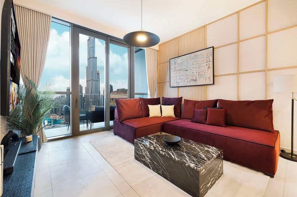 Inviting living area with floor-to-ceiling windows and premium entertainment features