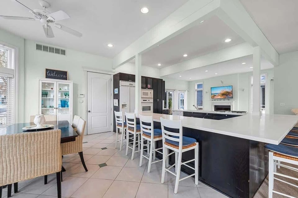 Cook together while everyone stays connected across the open living space.