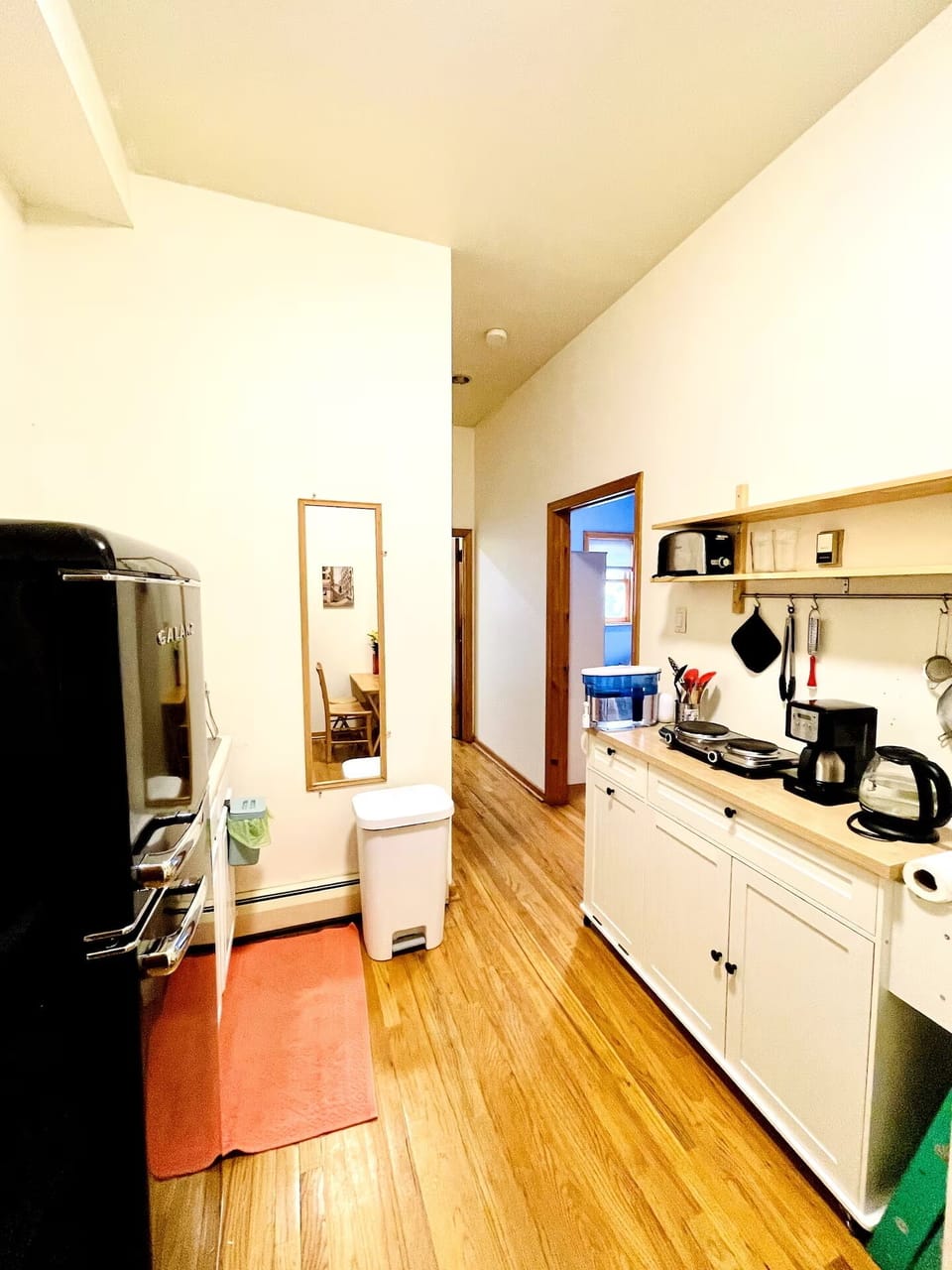 Kitcheonette has full size fridge, microwave, toaster over, hot plates + more