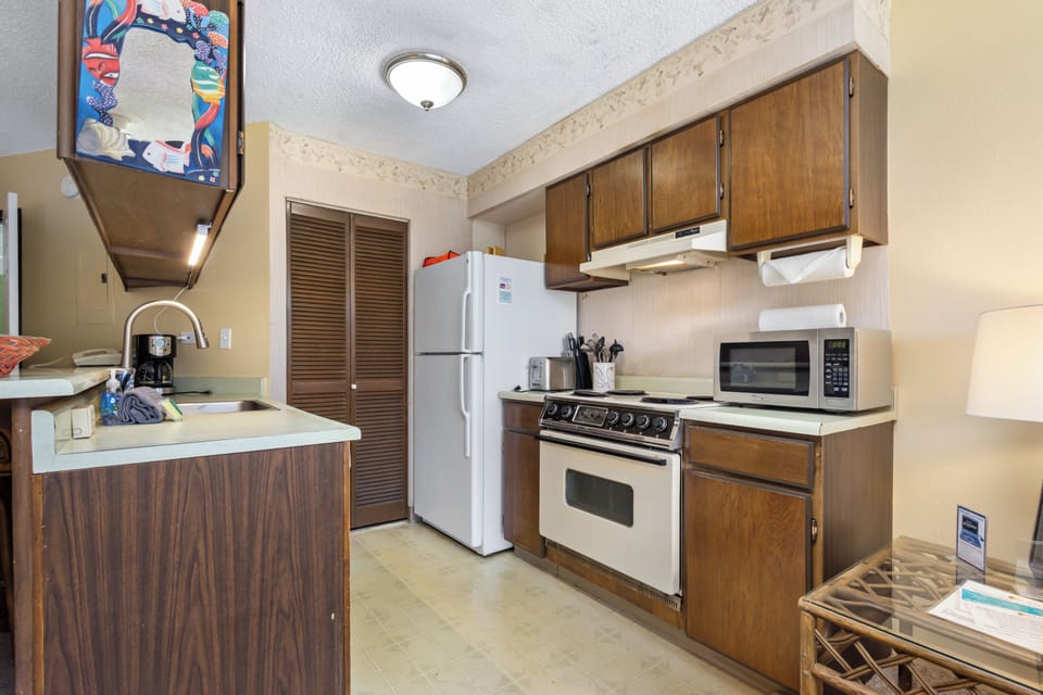 Your fully-equipped kitchen features everything you need to prepare delicious meals during your stay, from a full-size stove to a convenient microwave and ample counter space.
