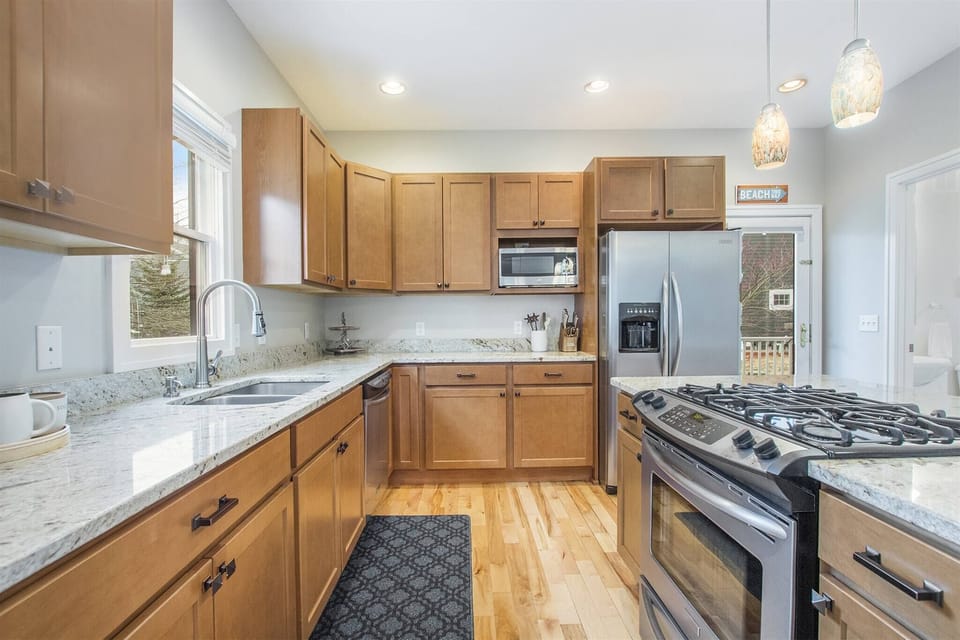 Fully equipped kitchen with stainless appliances and plenty of counter space.