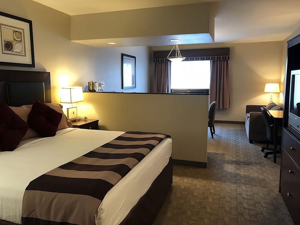 Recharge in a quiet bedroom with extra space to lounge.