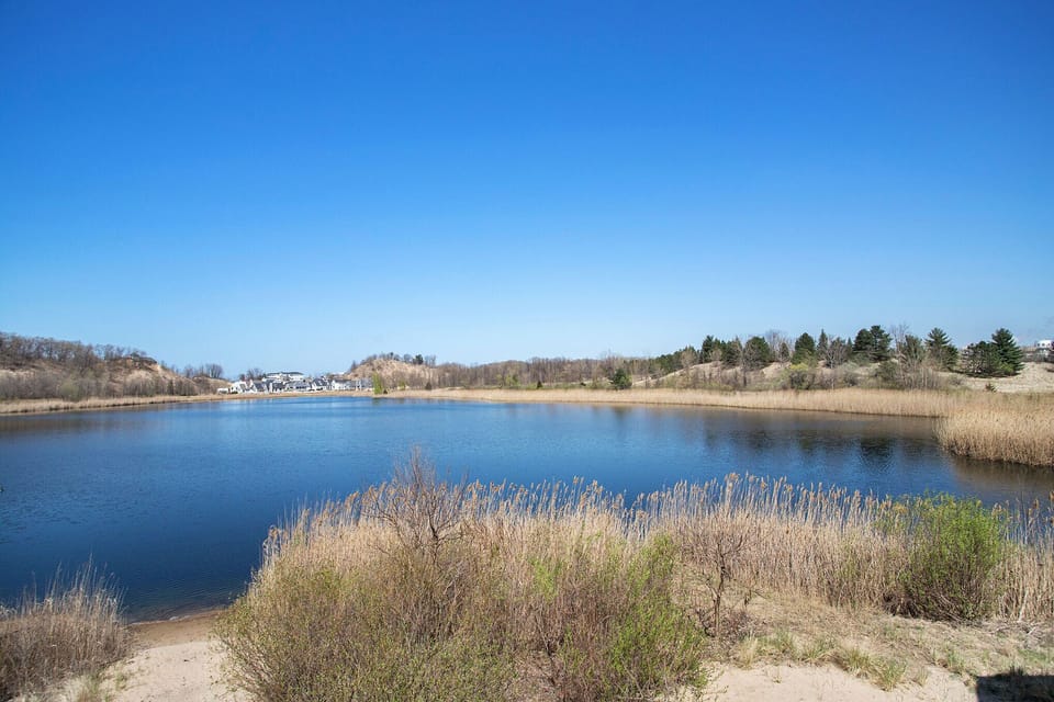 Coffee in hand, toes in the sand, and the beach at your doorstep.