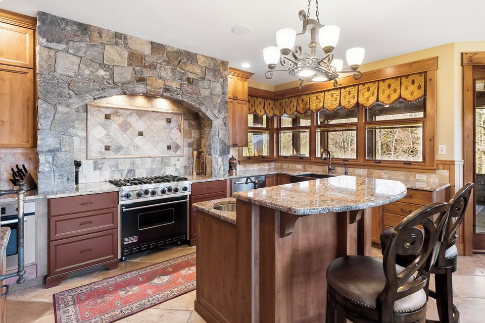 Main level chef's kitchen with island seating. 