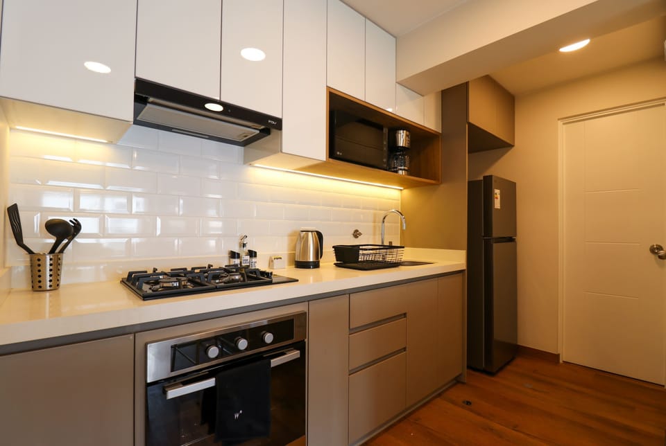 Fully equipped kitchen with modern appliances.