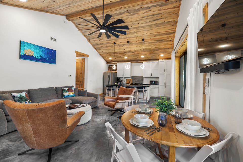 There is high-top seating for 4 a the kitchen island, with the option to use additional pull-out table seating for 4.