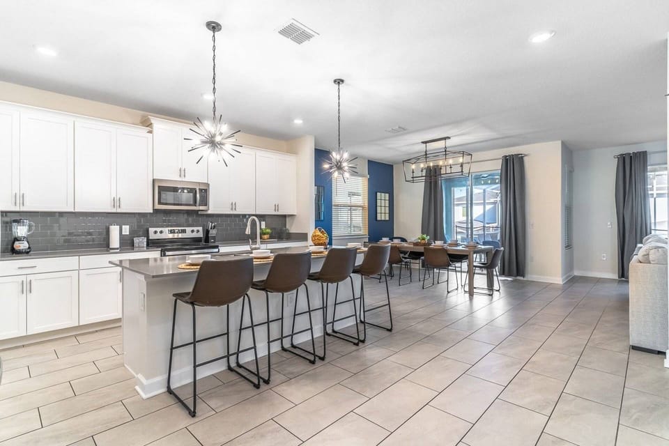 Bright and modern kitchen and dining area with bar seating for 4