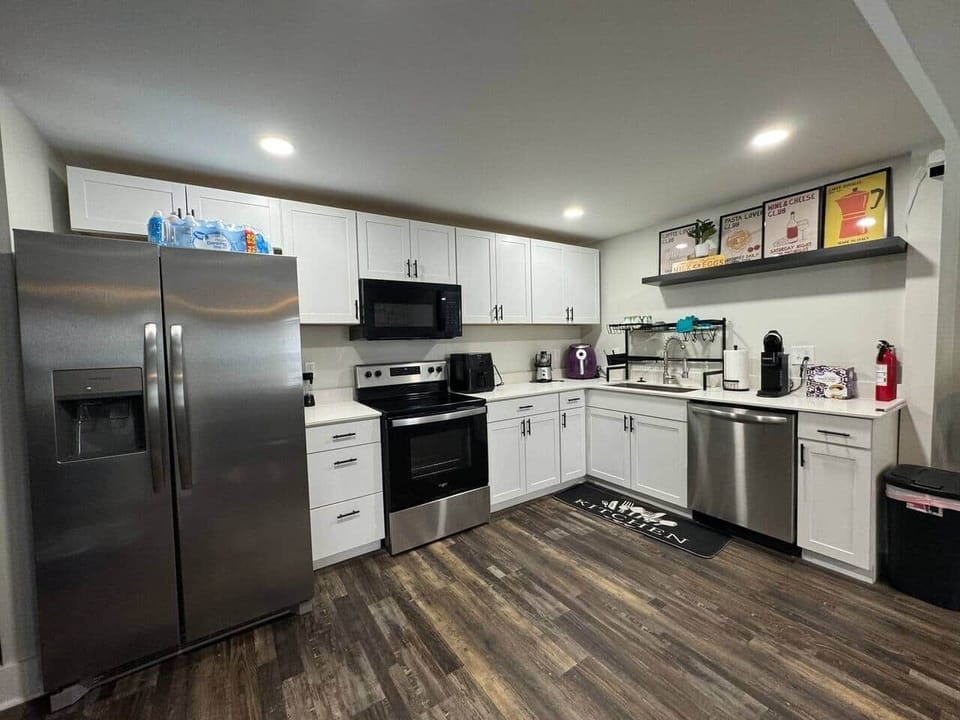 The full kitchen offers plenty of room to prep meals, with a large fridge, stove, microwave, and dishwasher to make cooking and cleaning a breeze.