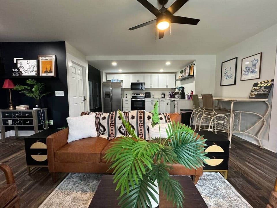 Sink into the plush seating of our living room, complete with soft throws and inviting pillows, making it the perfect place to relax after a busy day.