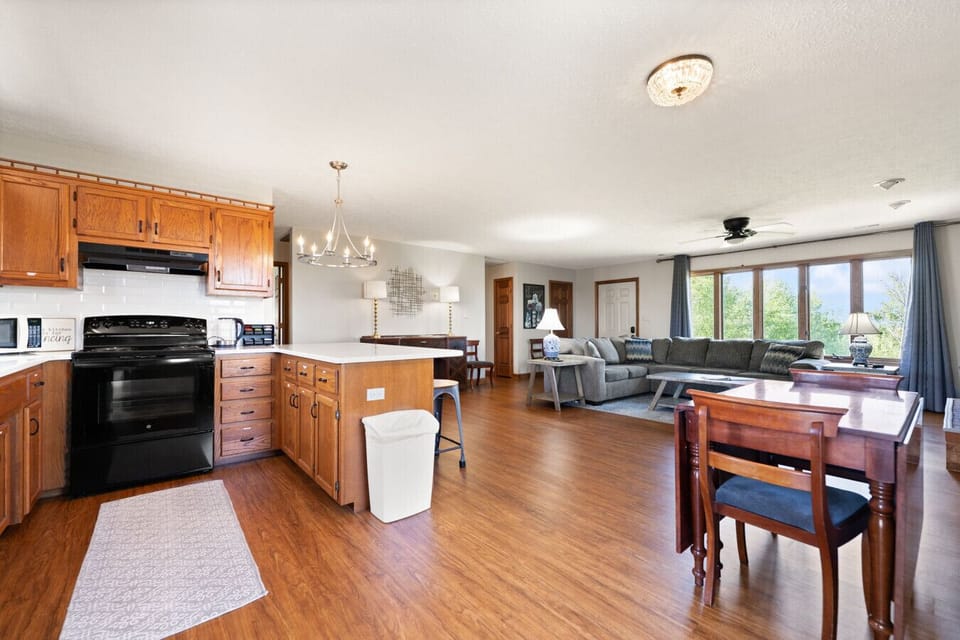 Living Room | Sectional Sofa | Ceiling Fan & Kitchen View