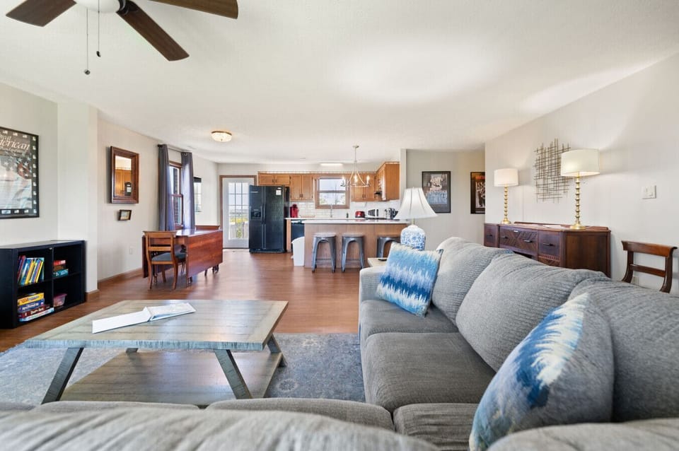 Living Room | Brick Fireplace | Smart TV & Hardwood Flooring