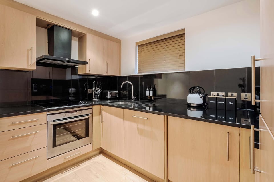 Full Kitchen | Fully equipped kitchen with everything you need for a short or long stay, including a fresh water dispenser, coffee machine, washing machine and dryer, and a dishwasher.
