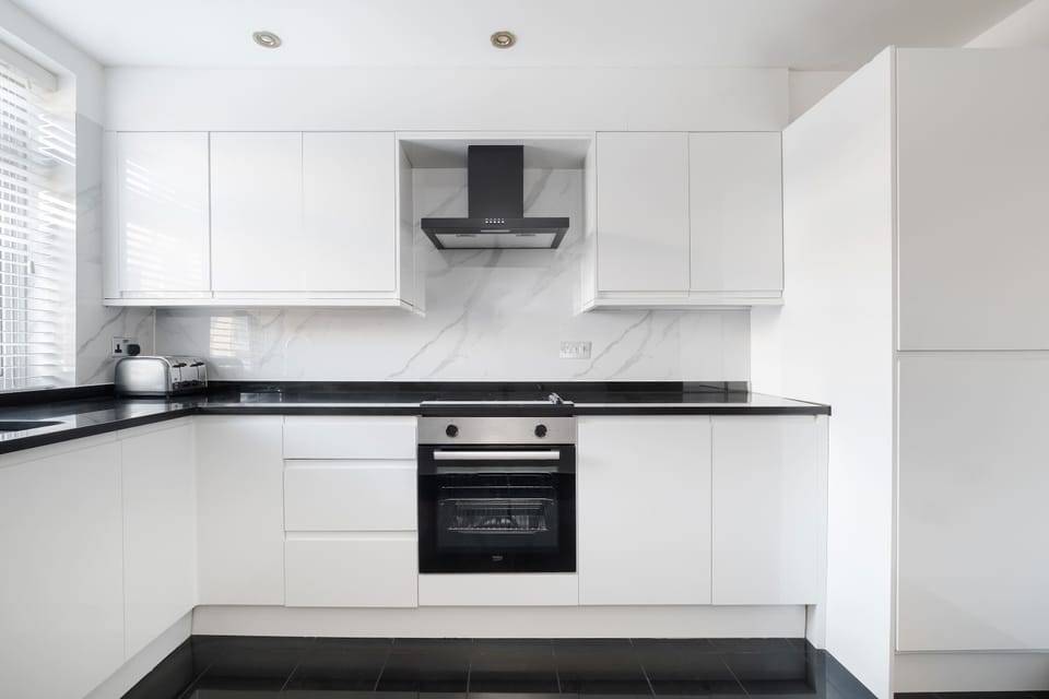Full Kitchen | Fully equipped kitchen with everything you need for a short or long stay, including a fresh water dispenser, coffee machine, washing machine and dryer, and a dishwasher.