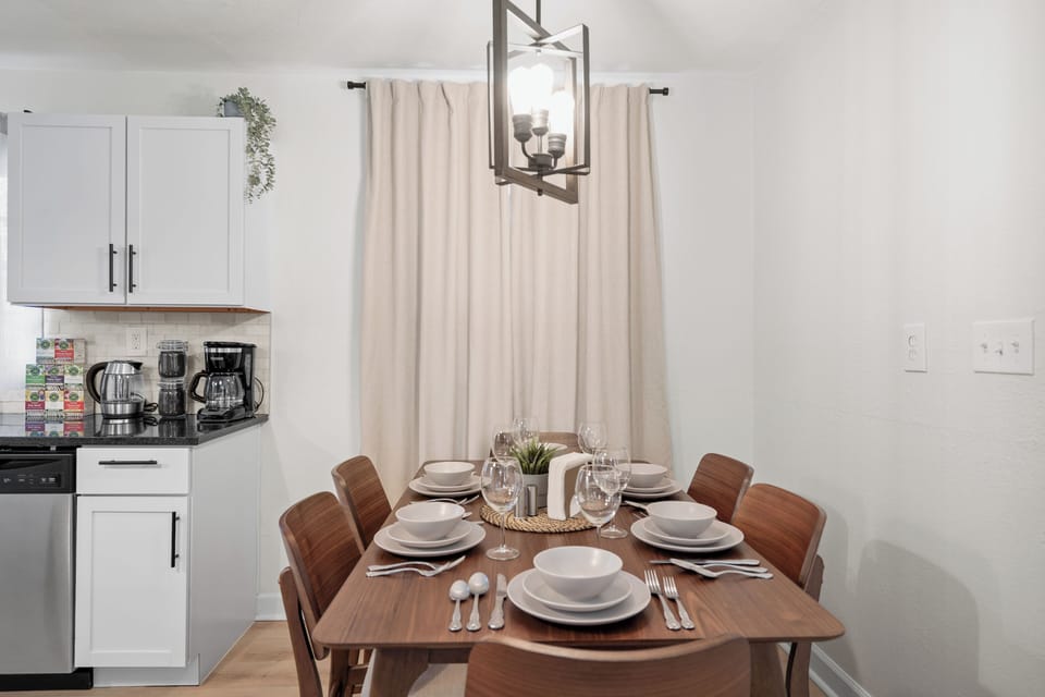 Cozy Dining Area with Modern Table for Six and Warm Lighting