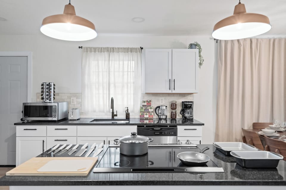 Bright, Modern Open Kitchen Stocked with Organic Coffee, Tea, and Spices
