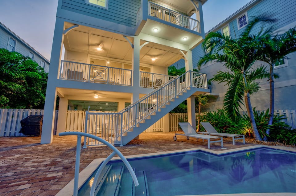 Exceptional luxury vacation home with a heated private pool located inside an exclusive Marathon FL community. Perfect for families seeking high-end Florida Keys accommodations with security, privacy, and top-tier amenities.