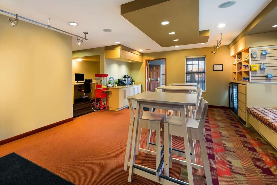 Unwind in the airy lounge with communal tables and warm lighting.