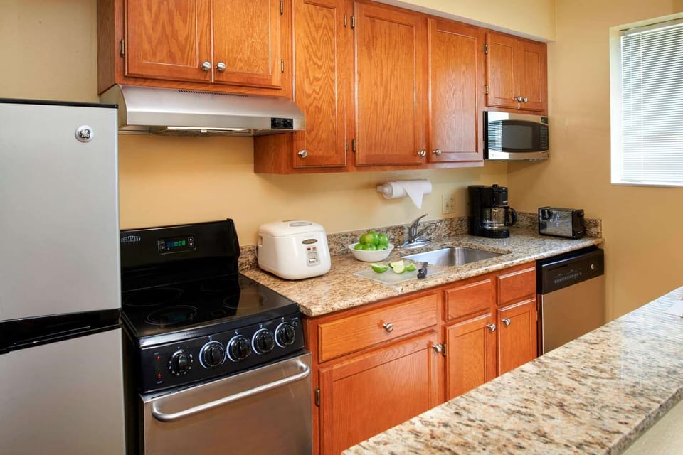 Start mornings with fresh coffee in this well-equipped kitchen.