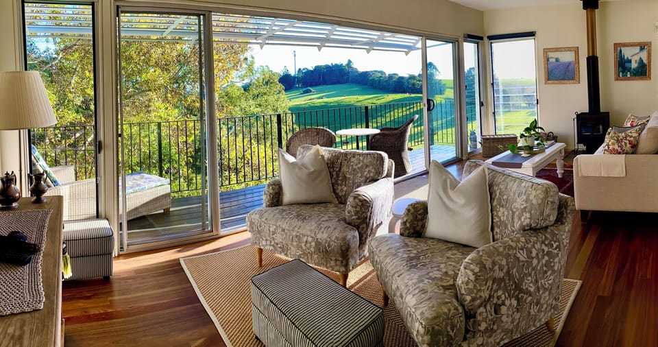 Living area looking out to deck and views. 