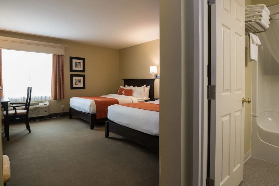 Settle in with ample space, soft linens, and a work desk.