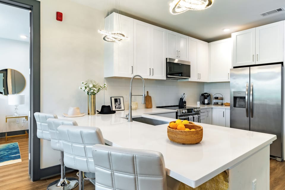 Fully equipped kitchen with barstool seating.