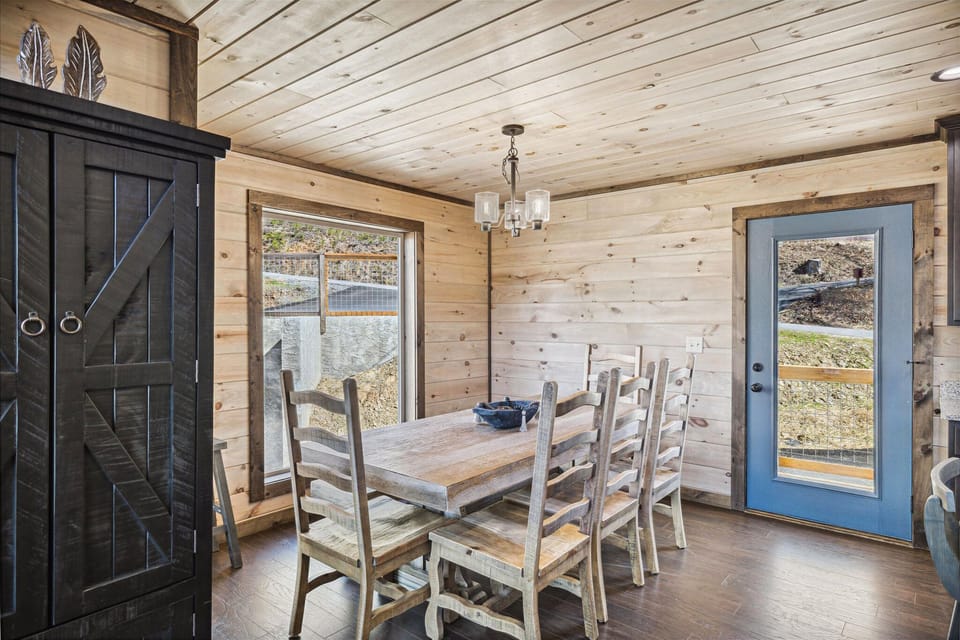 Large wooden dining table set for family meals.