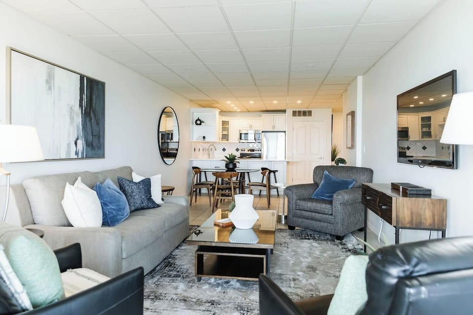 Spacious and inviting open-concept living! This bright area seamlessly blends the living room, dining nook, and full kitchen, making it ideal for socializing and making memories.
