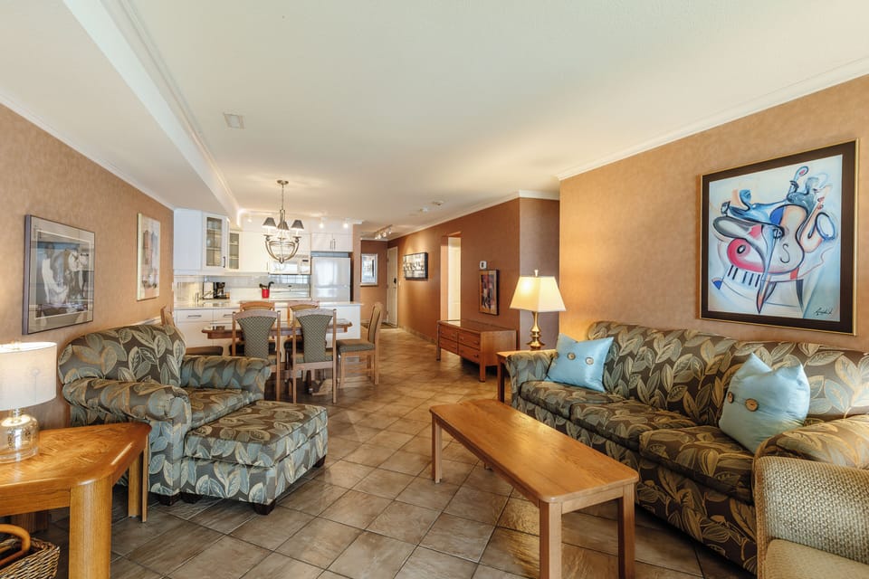 Open-concept living space with a fully equipped kitchen, spacious dining area, and cozy lounge seating—ideal for relaxing or entertaining