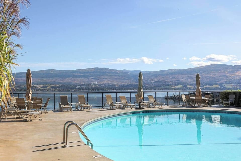 Relax by the swimming pool, complete with comfortable lounge chairs