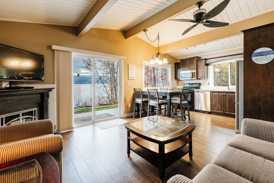 One of our favorite features of the home—this bright, open space looks right out to the lake. Whether you’re cooking, sharing a meal, or relaxing, you’ll always have a beautiful view just steps away.
