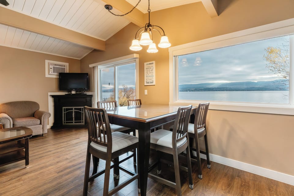 Gather around the dining table and enjoy uninterrupted lake views—our favorite spot for slow breakfasts, card games, and sunset dinners with the water just beyond the windows.