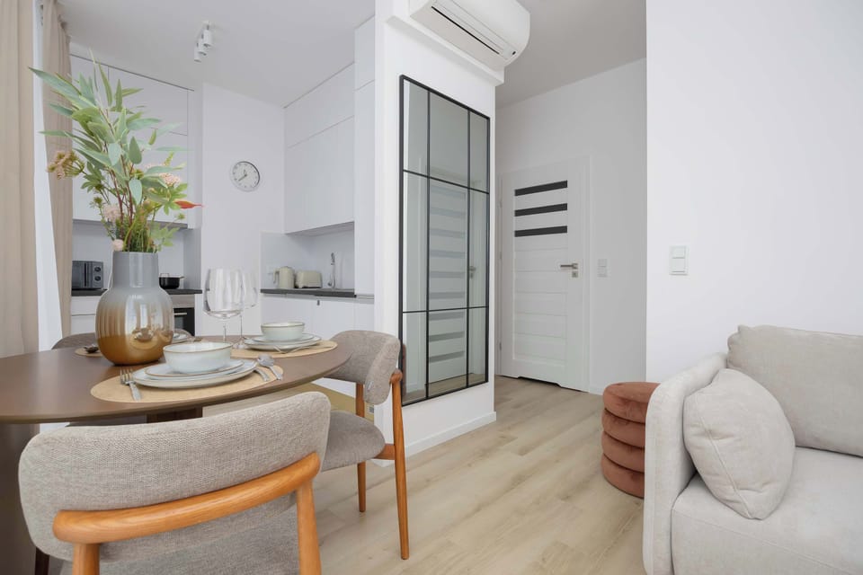A dining area connected to the living space offers a sense of openness and comfort for shared meals and everyday relaxation.