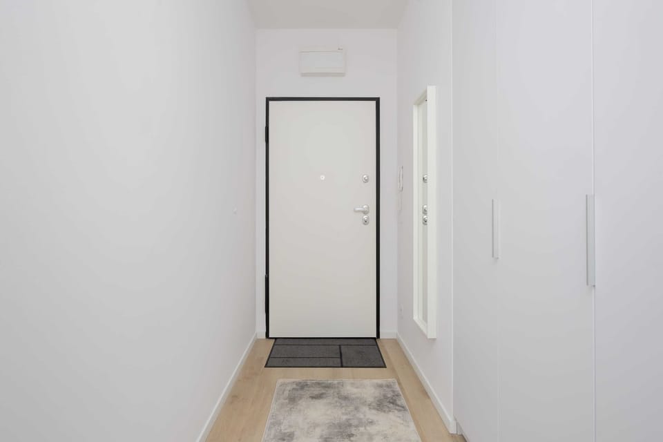 A bright hallway with clean-lined built-in storage creates a sense of order and calm from the very first step inside.