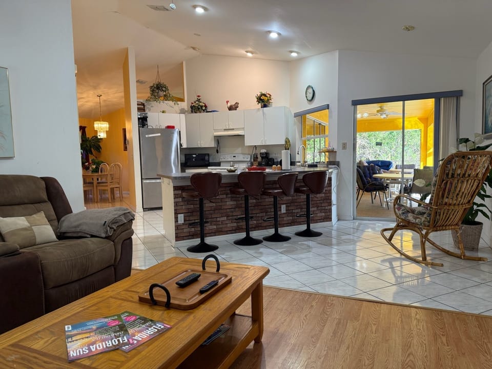 open living with living room and kitchen with bar