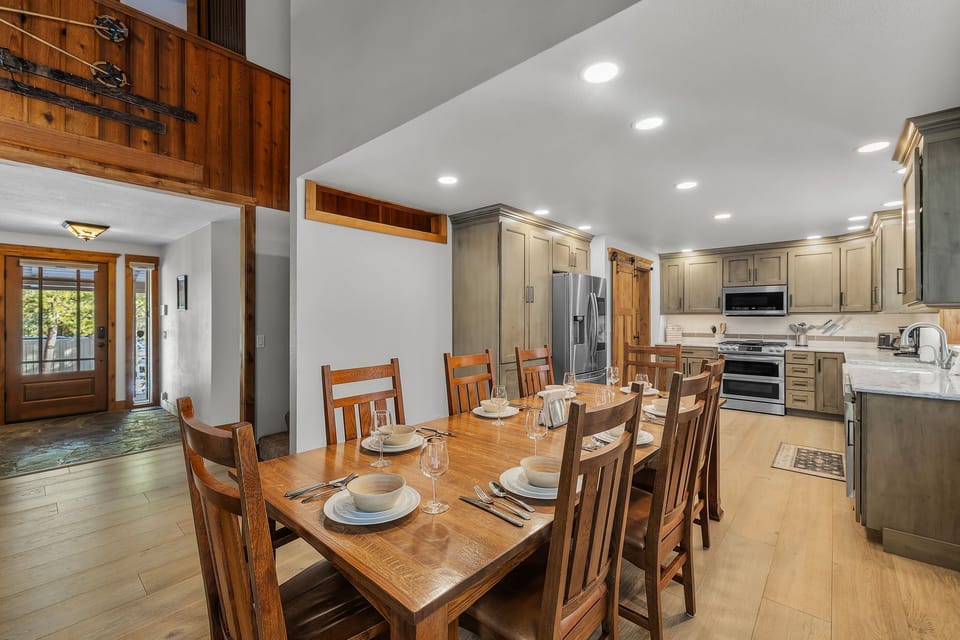 Gather around the spacious dining table where you'll share memorable meals, flowing seamlessly into your fully-equipped kitchen.