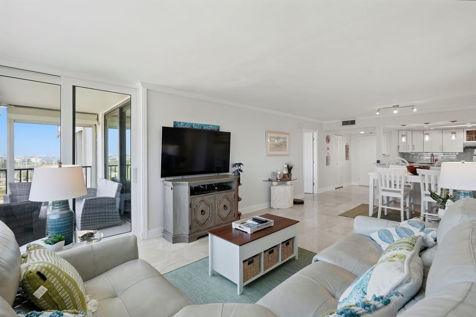 Bright and inviting, the living room is filled with natural light and offers a comfortable space to relax, stream your favorite shows, or unwind together while enjoying the coastal bay area ambiance.
