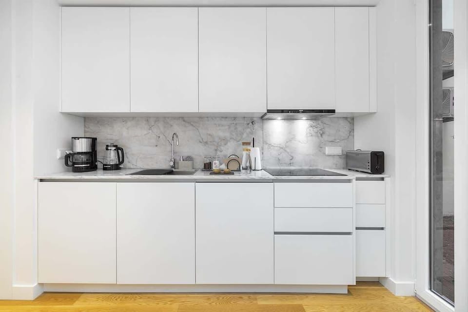 The kitchen has all the kitchenware that needed to cook. 
All the home appliances are SIEMENS. The cooktop is new type burn protected induction cooktop.
In the kitchen, you will find ground coffee and tea available.