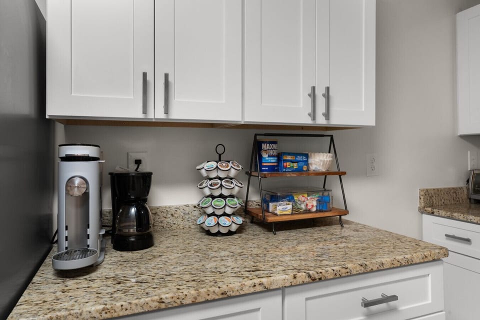 Start your mornings with a fully stocked coffee station featuring both drip coffee and single-serve options, plus complimentary coffee, tea, and essentials.
