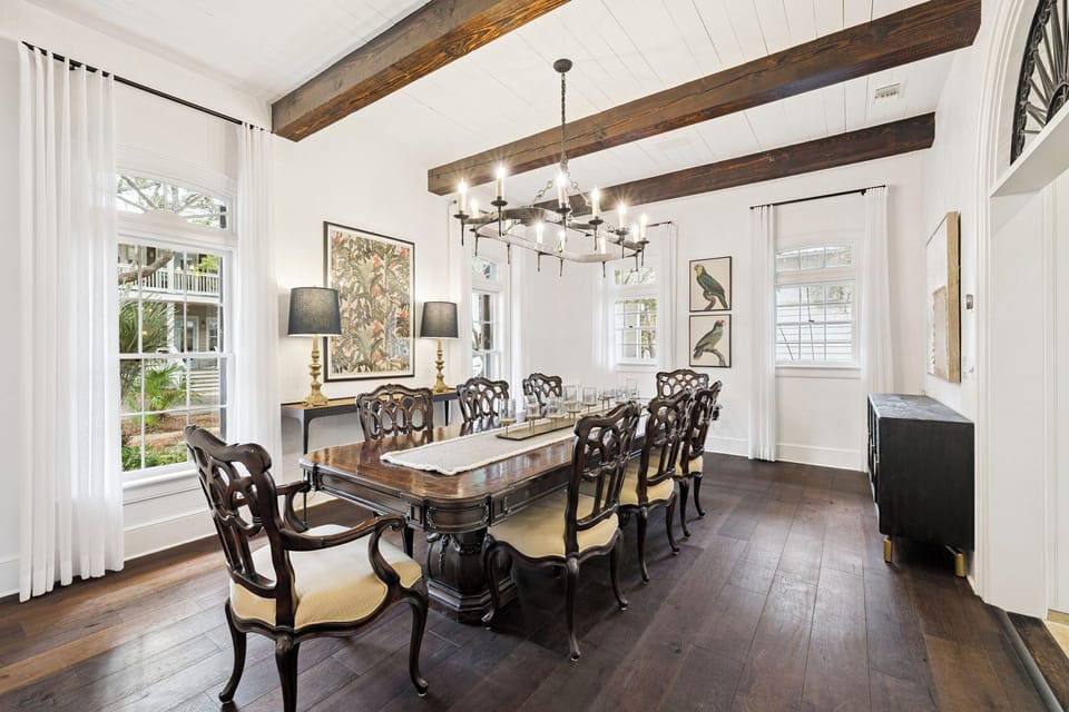 Your elegant dining room features stunning exposed beams overhead and a classic chandelier casting warm light for memorable meals together.
