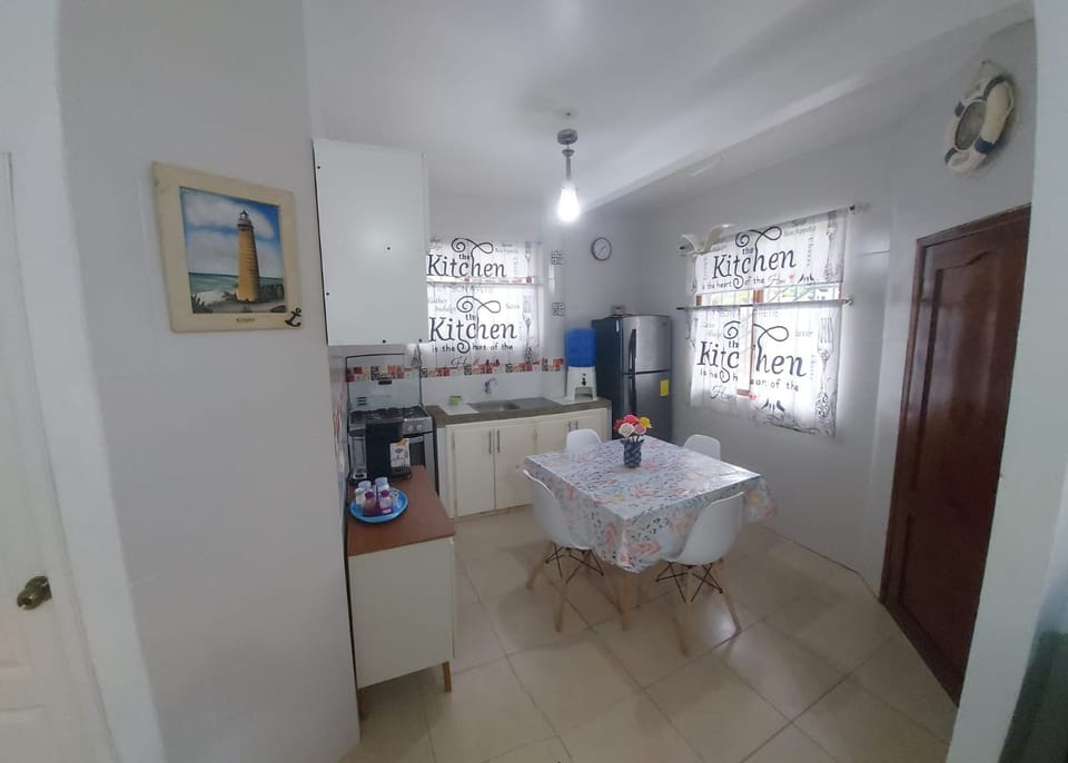 Cozy, sunlit kitchen with dining area- perfect for home comfort