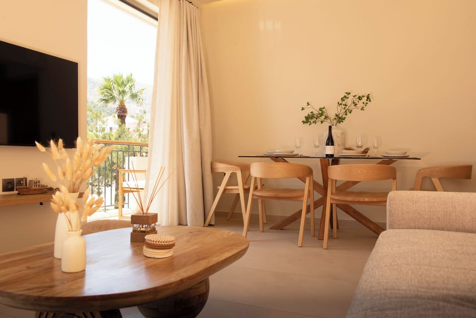 Bright & airy open-plan living and dining area, blending comfort and character.