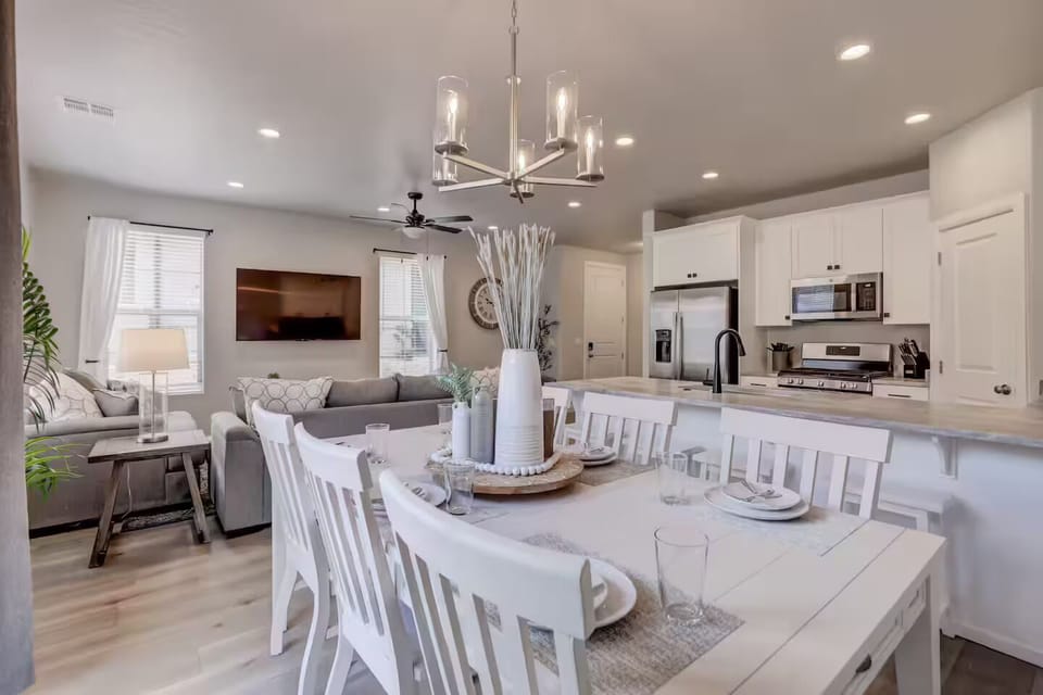 An inviting open space where the kitchen, dining, and living areas come together for effortless family time and entertaining.