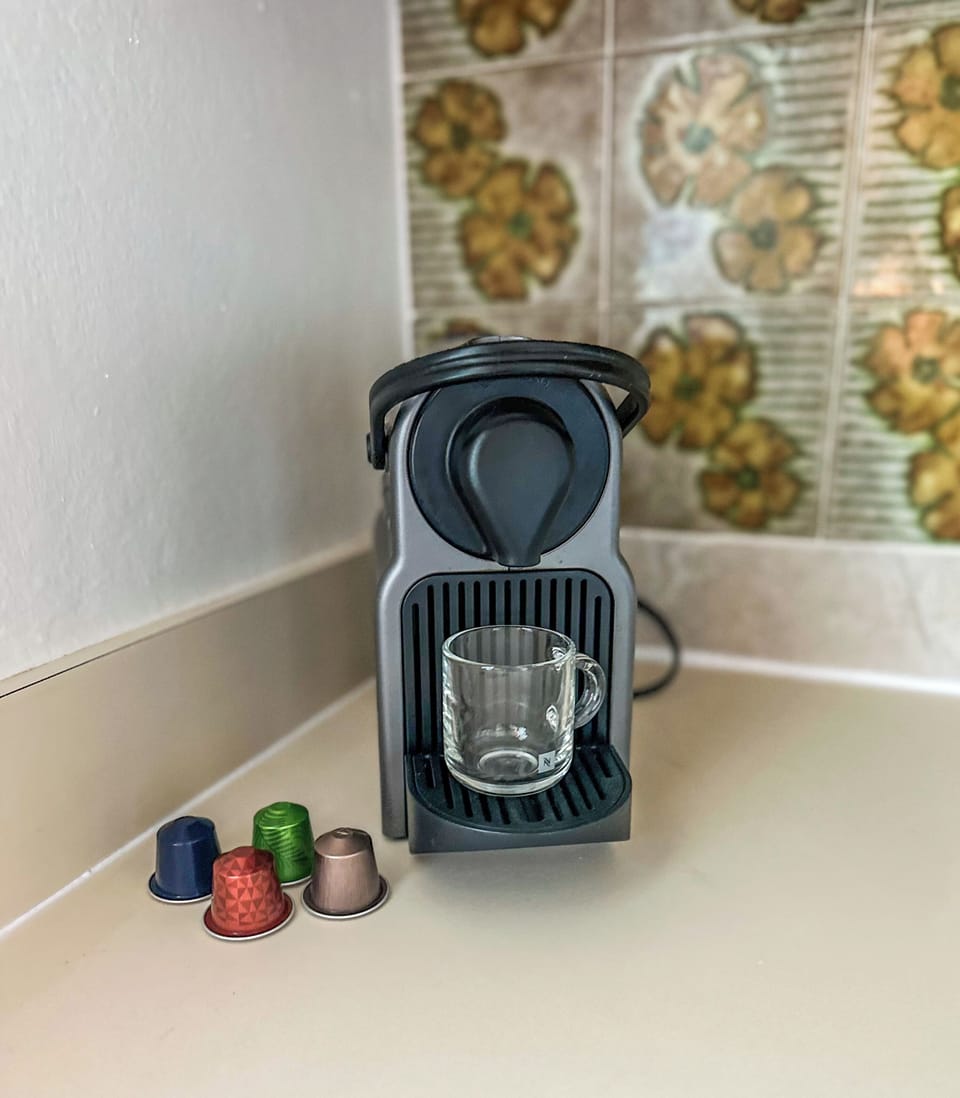 Nespresso machine with 1pod/person/day provided. French press is also available.